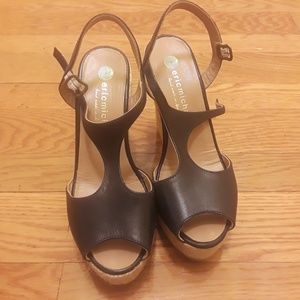 Black leather Eric Michael wedge sandals